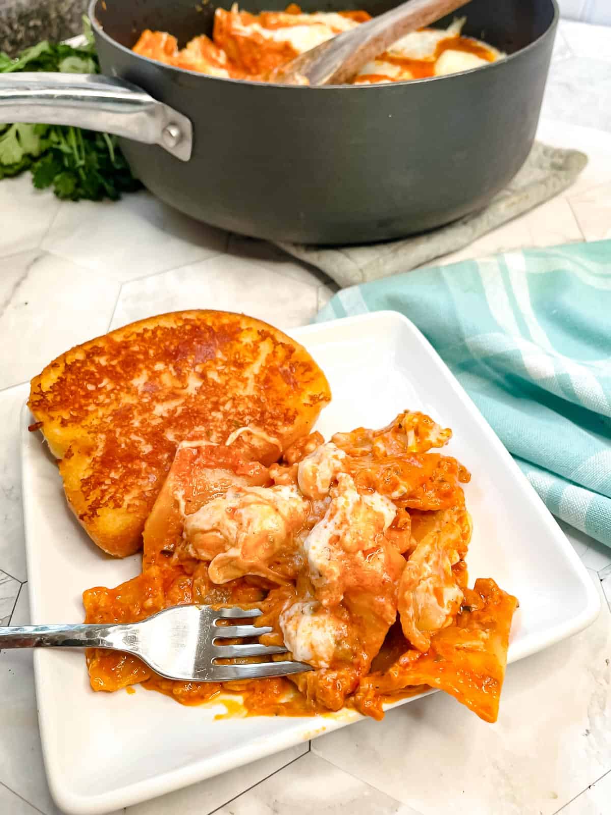 A white plate of the finished dinner.