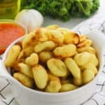 A white bowl of the air fryer gnocchi.