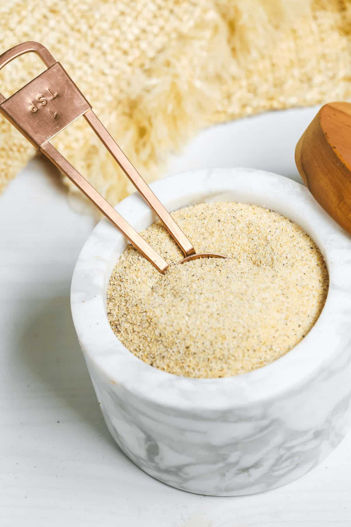 A container of the all purpose seasoning.