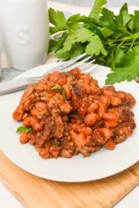 A white plate with the finished side dish o it.