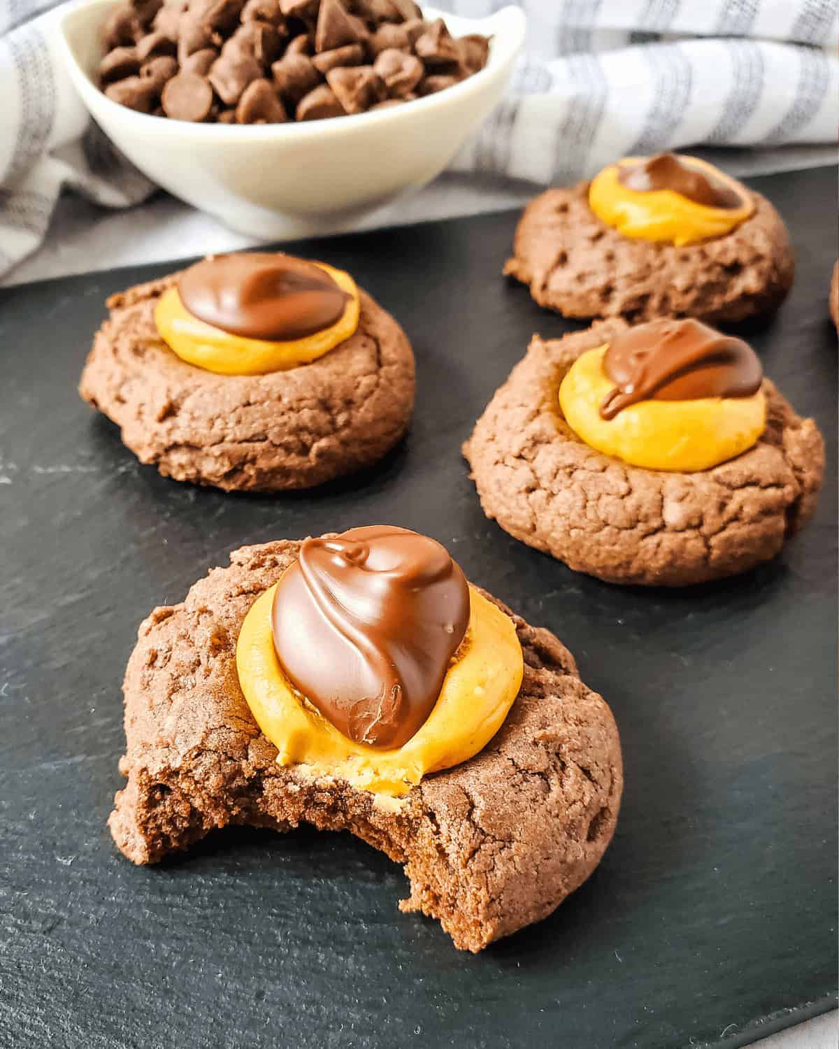 A bite taken out of a buckeye brownie cookie.