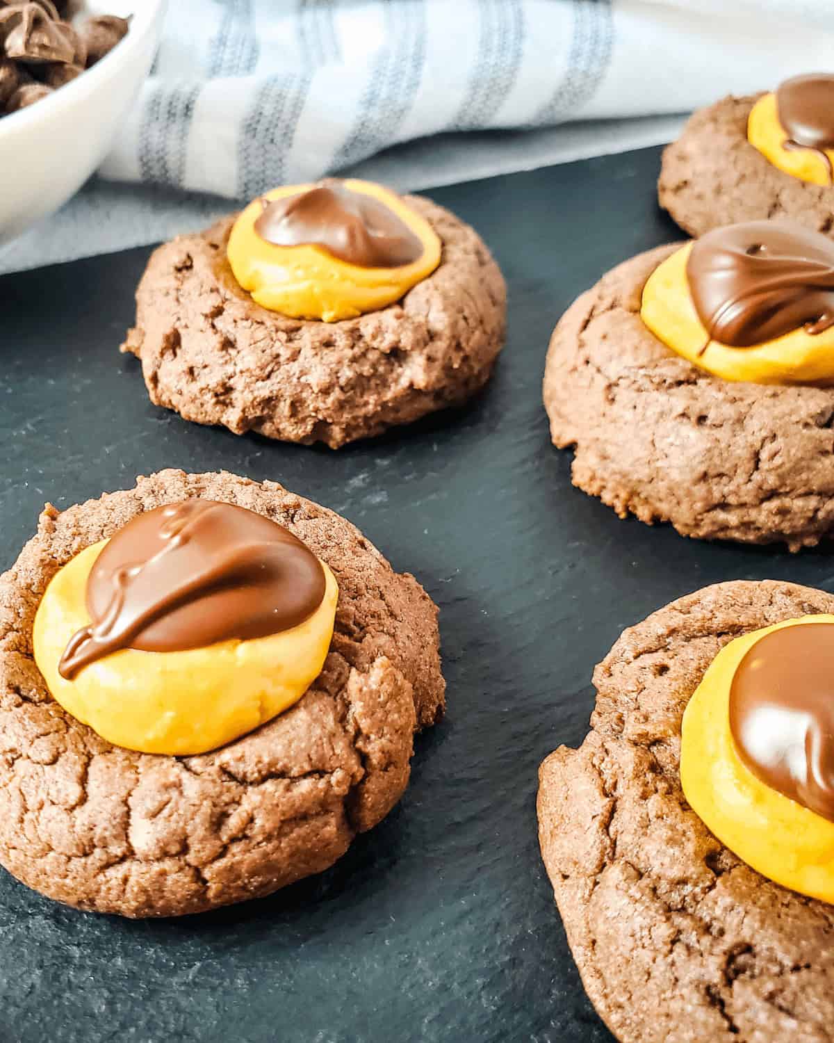 A group of the cookies on a slate tray.