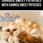 A serving of Candied Sweet Potatoes with Canned Sweet Potatoes topped with melted marshmallows on a white plate, with a dish in the background. Text reads “Easy Candied Sweet Potatoes with Canned Sweet Potatoes.”.