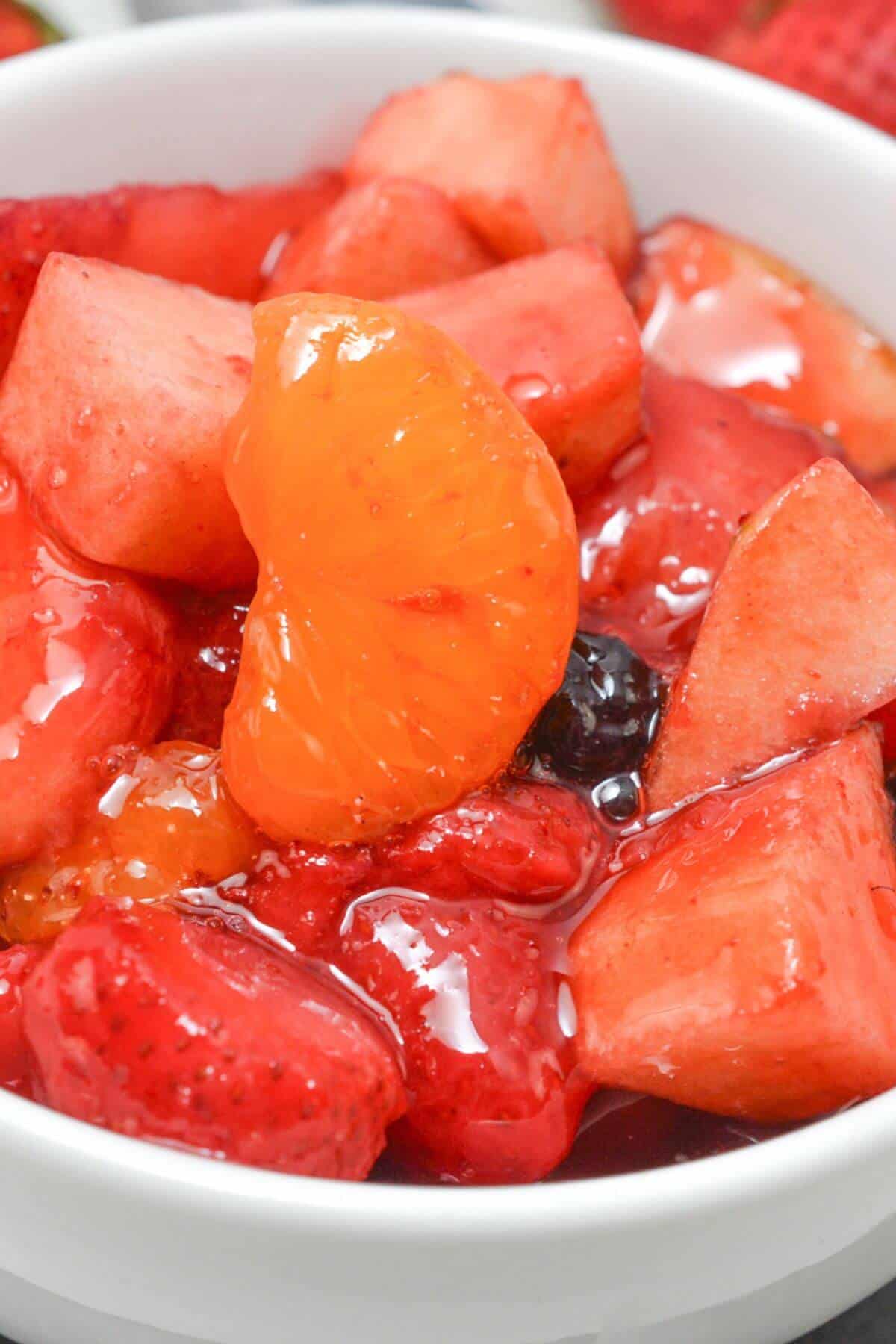 A close up on the cherry jello fruit salad.