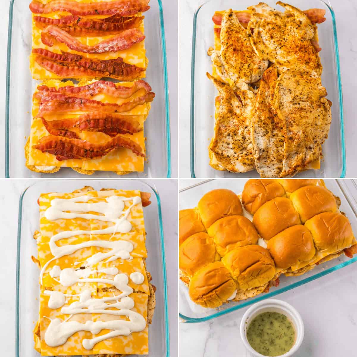 Bacon and cheese slices in a baking dish, topped with seasoned chicken, drizzled with ranch sauce, and covered with buns. A small container of extra ranch sauce is beside the dish.
