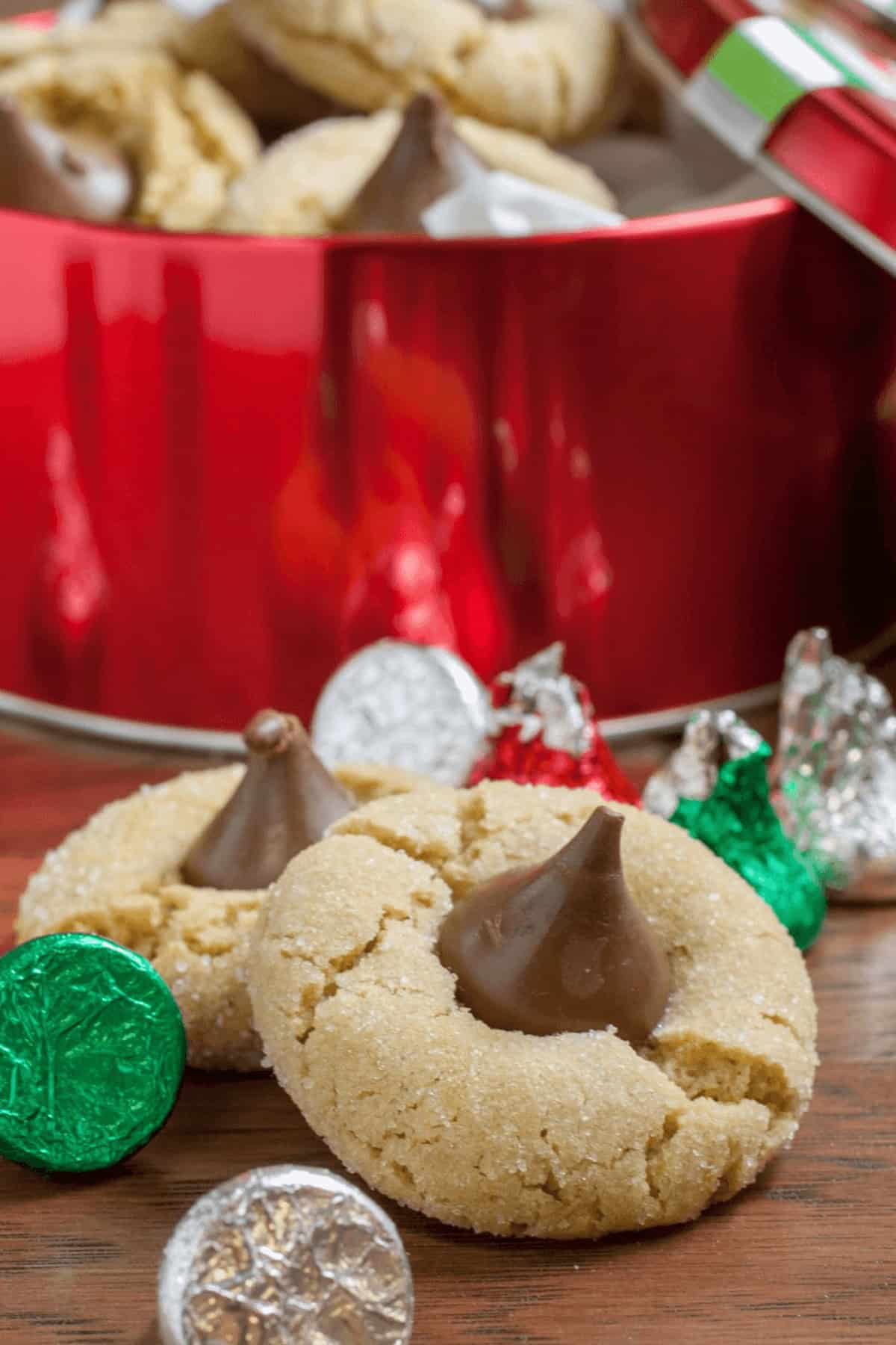 A tin of chocolate kiss cookies.