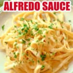 White plate filled with Alfredo and parsley on top