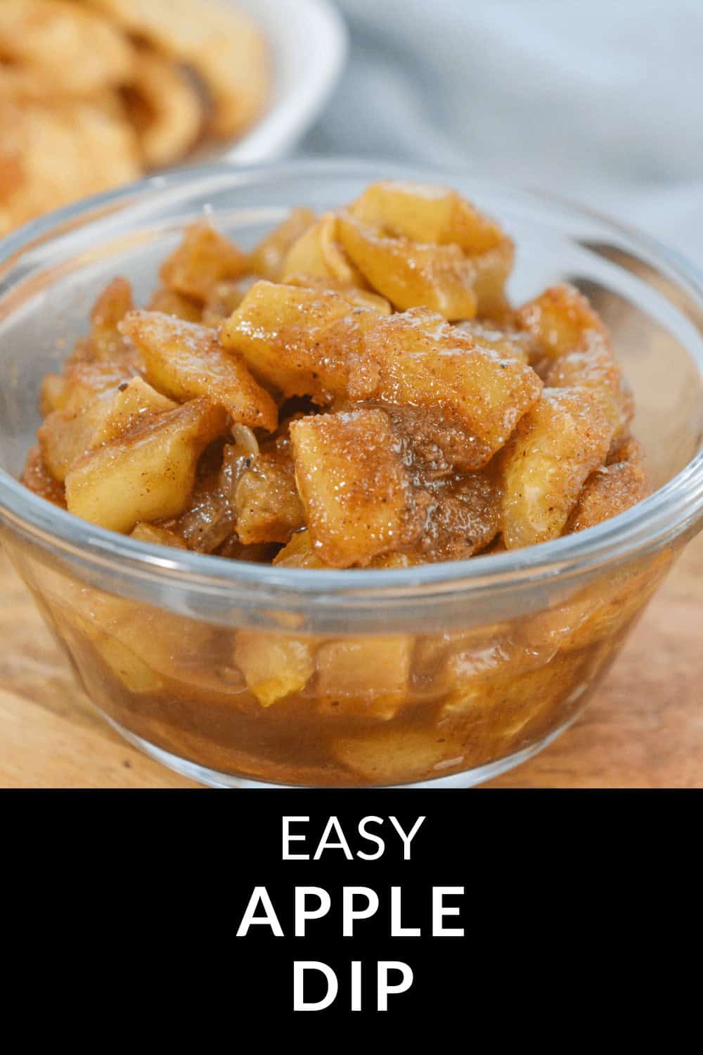 A glass bowl brimming with easy apple dip showcases diced apples, cinnamon, and a luscious sauce. Text at the bottom reads "Easy Apple Dip.