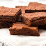 A white platter of amazing homemade brownies.