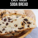 Slices of Easy Irish Soda Bread with raisins rest in a wicker basket on a striped cloth, under a text header reading "Delicious Easy Irish Soda Bread.