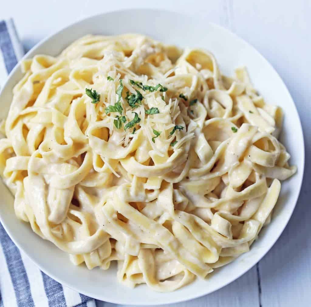 Alfredo on a white dish.