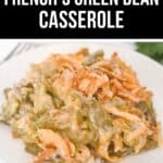 A serving of French’s Green Bean Casserole, topped with crispy fried onions, is plated on a white dish.