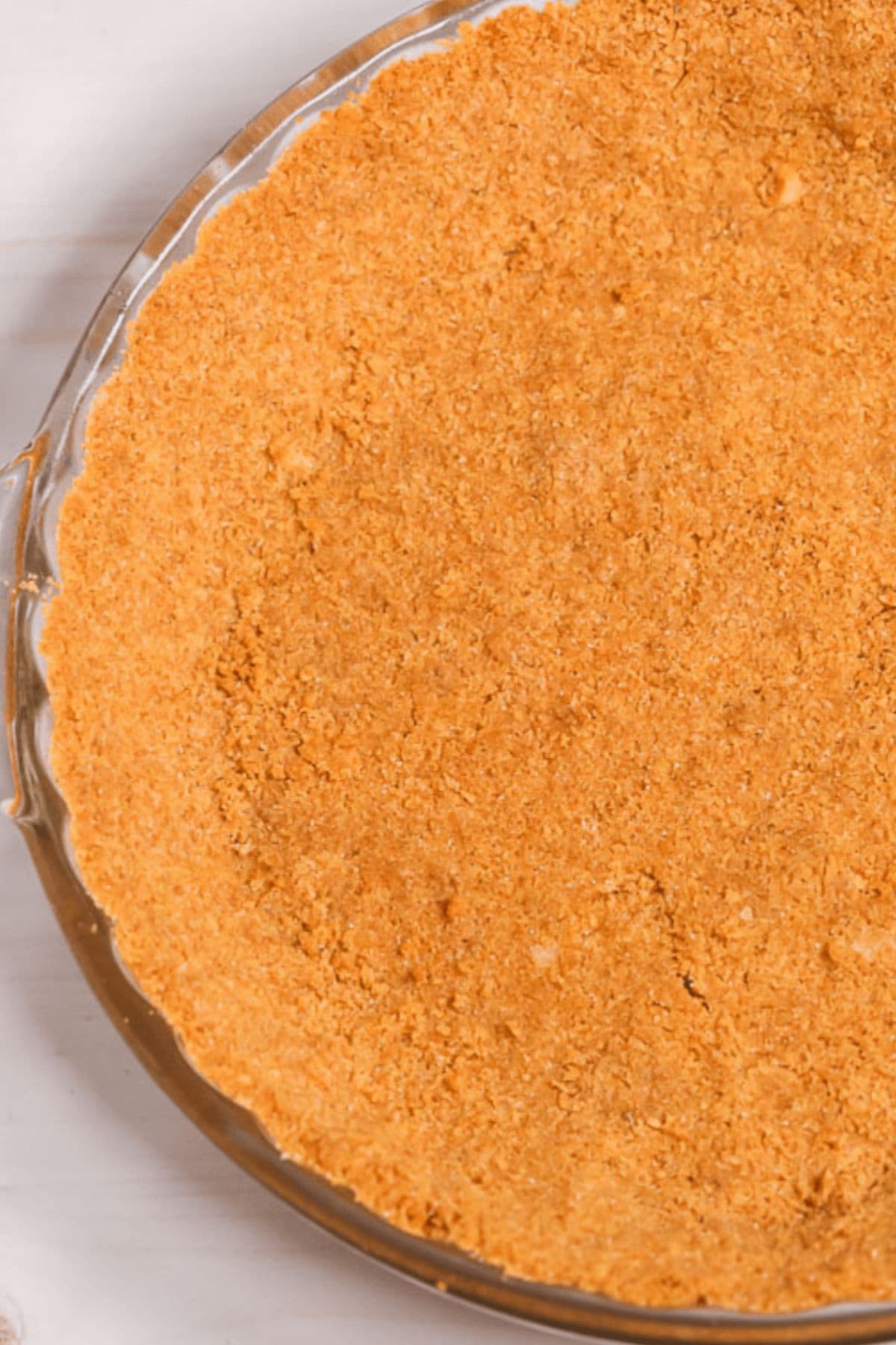 A close-up of a round glass pie dish, ready for your favorite filling.