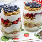 A pari of the breakfast with blueberries in the background.