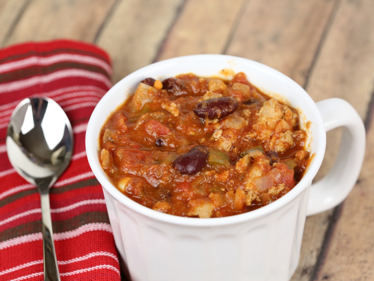 Close up of the turkey soup in a mug.