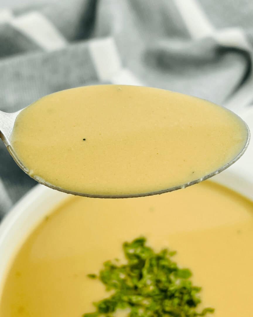 A spoon with ham gravy on it.