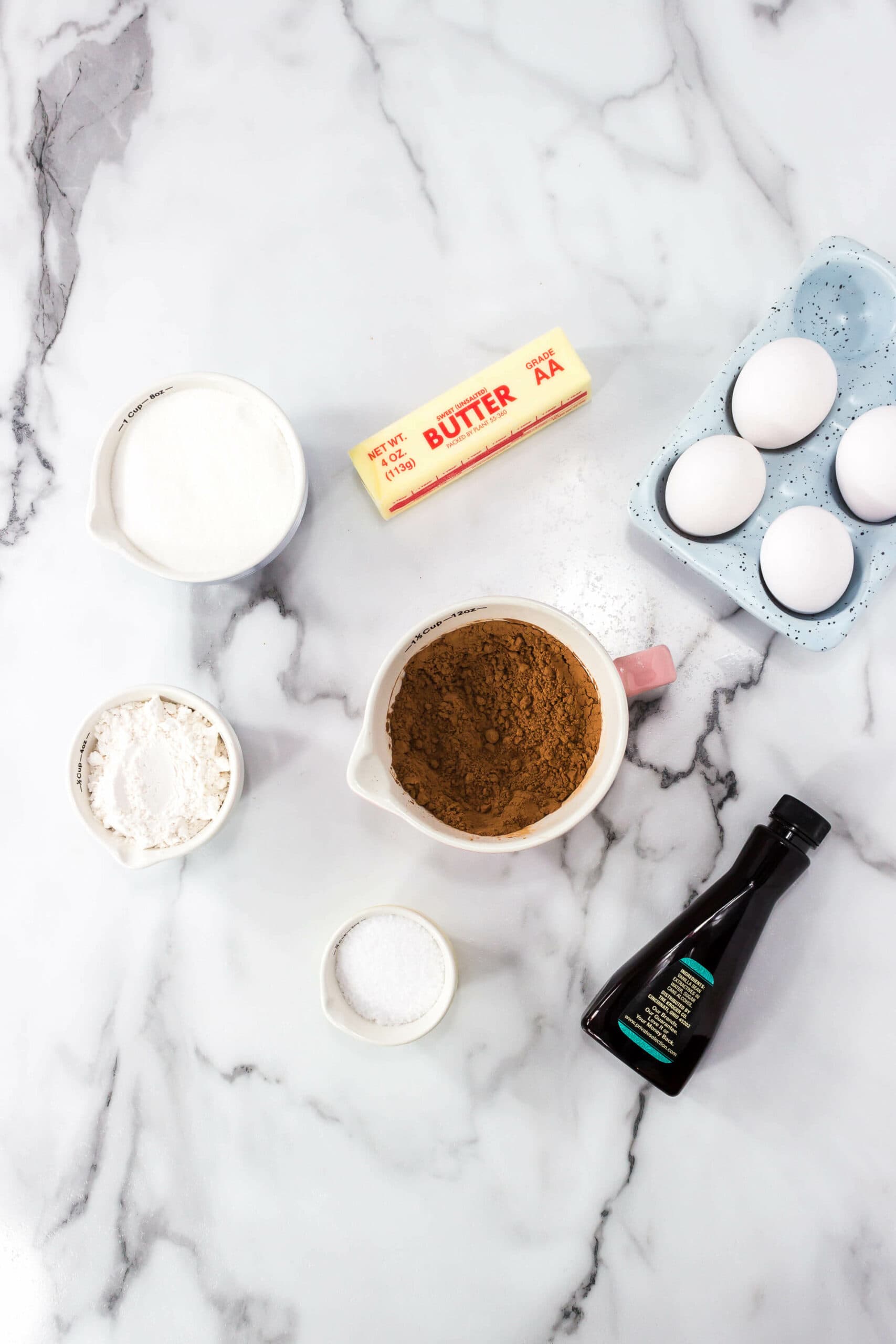 Chocolate, eggs, butter, vanilla to make the dish.