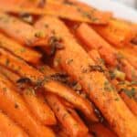 Close-up of the veggie garnished with chopped herbs, served on a white plate.