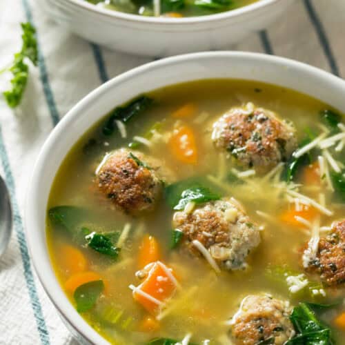 A bowl of italian wedding soup.