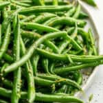 Italian green beans on a white plate.