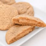Peanut butter stuffed cookies on a white plate.