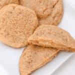 Peanut butter stuffed cookies on a white plate.