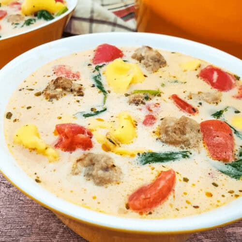 A bowl of Sausage Spinach and Tortellini Soup.