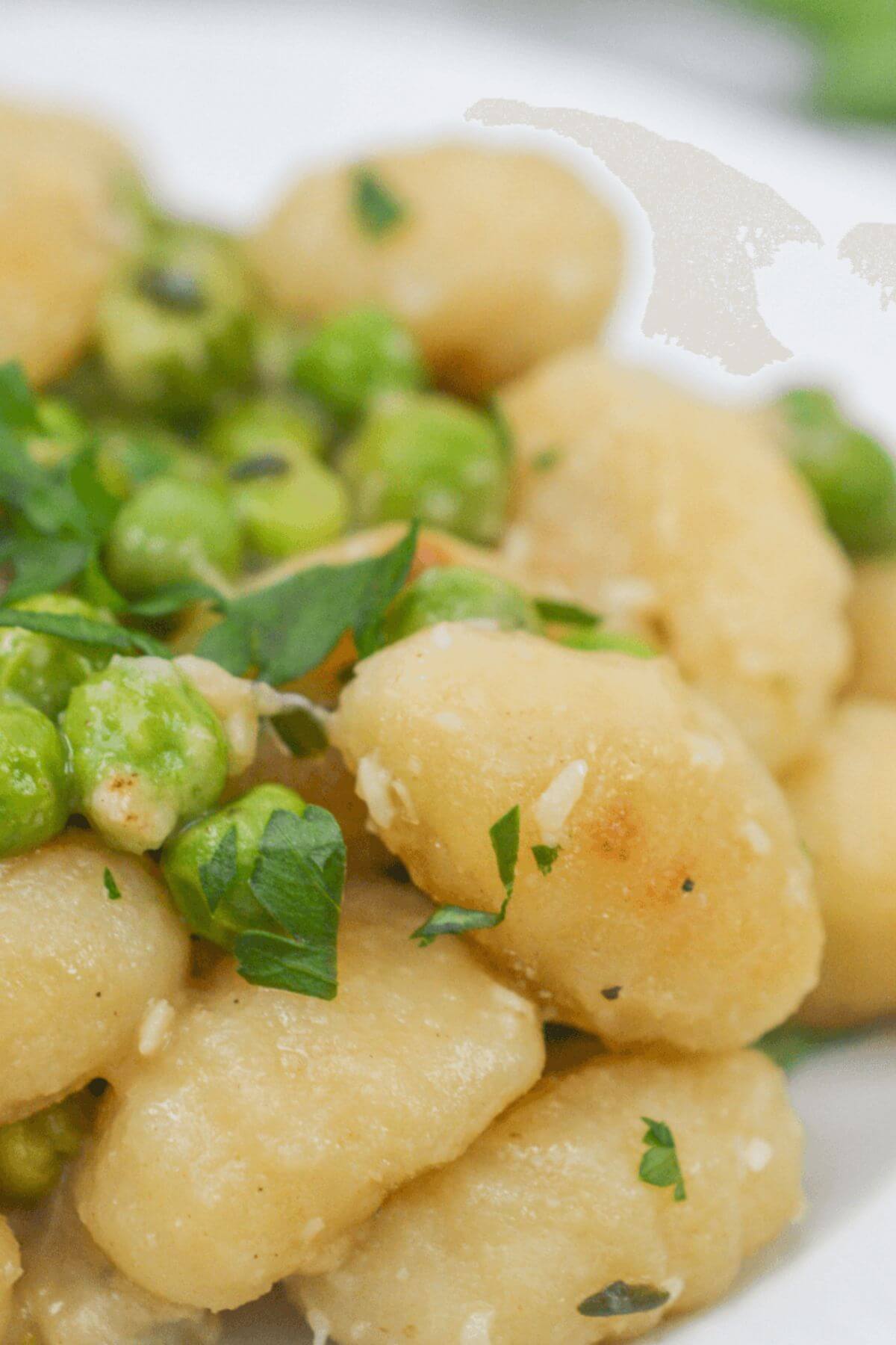 A closeup on the skillet gnocchi and peas.