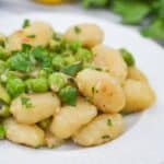A heaping dish of the potato gnocchi and peas.