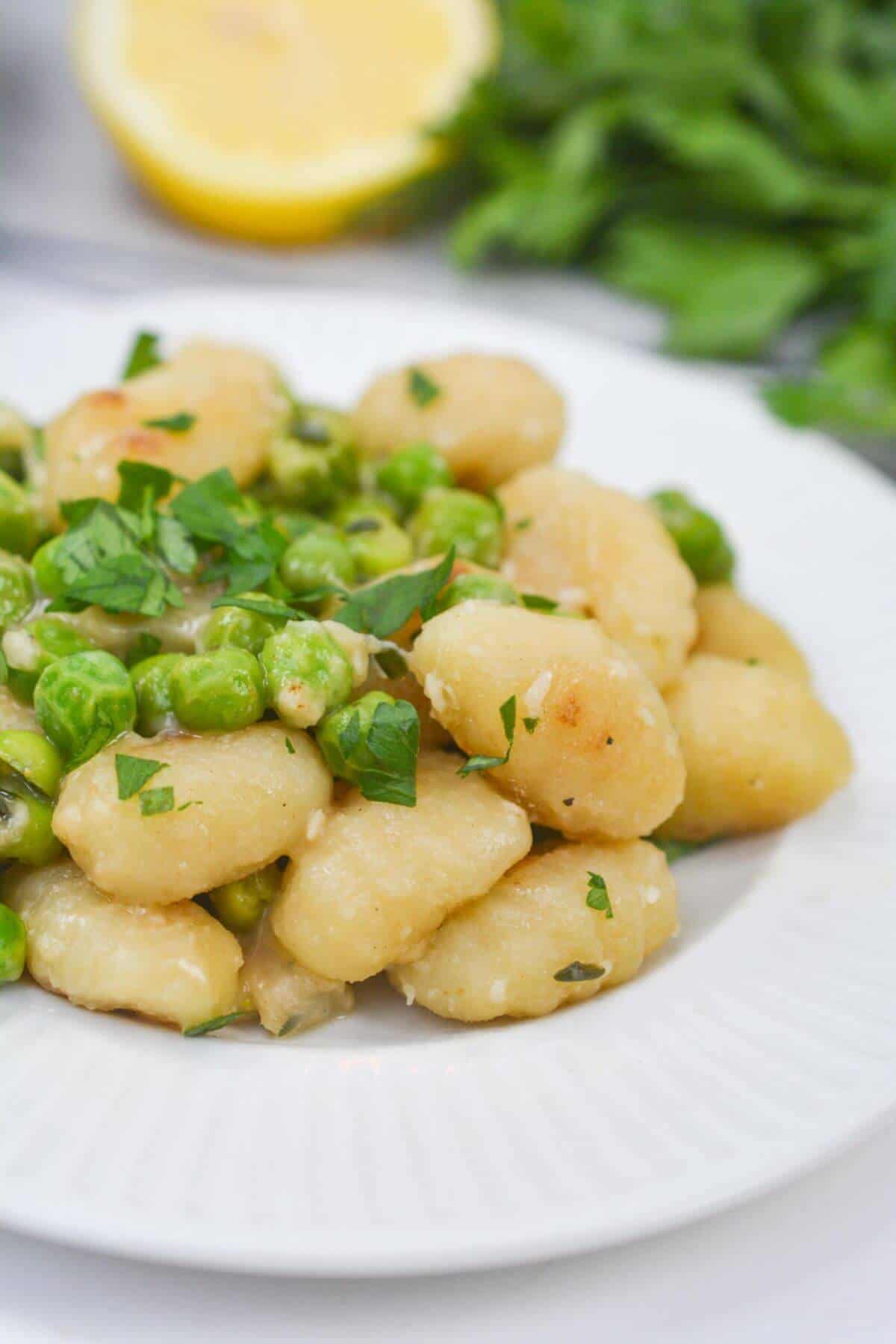 A heaping dish of the potato gnocchi and peas.