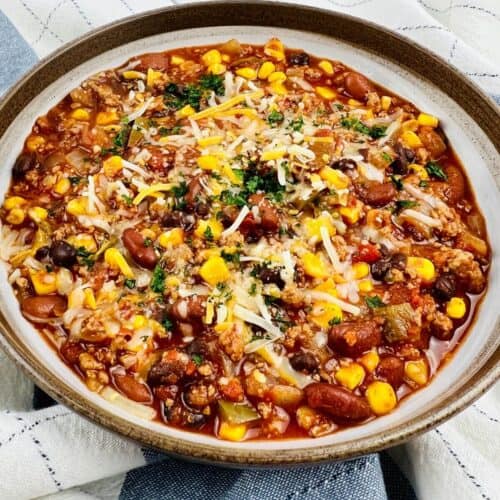 The chili on a checkered mat.