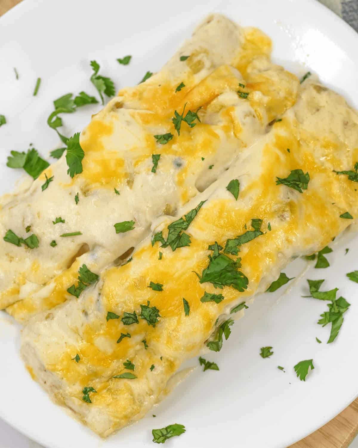 sour cream enchilada sauce on top of the chicken enchilada.