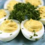 A plate of appetizer garnished with parsley.