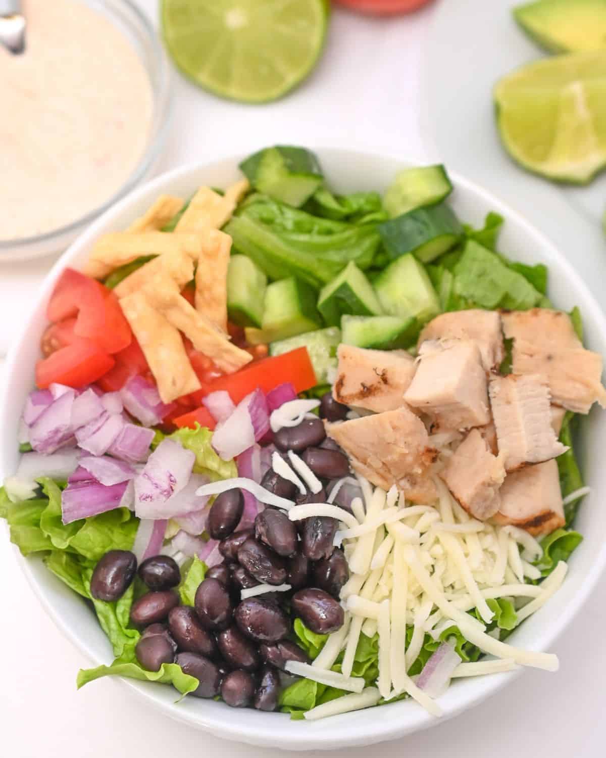 A white bowl filled with spicy southwest salad.