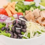 A white bowl filled with spicy southwest salad.