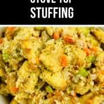 A bowl filled with a homemade Stove Top Stuffing Recipe featuring bread cubes, chopped celery, carrots, and flavorful herbs.