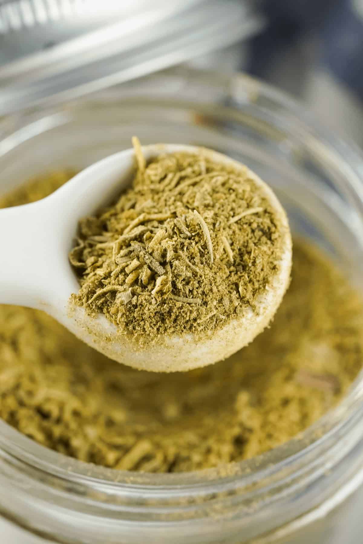 A spoon in a jar of the seasoning.