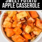 A bowl of Sweet Potato Apple Casserole topped with chopped pecans, featuring diced sweet potatoes and apples mixed with warm spices for a comforting fall treat.
