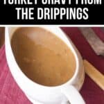 A white gravy boat filled with rich Turkey Gravy from the Drippings sits on a red cloth next to a knife. The top of the image features text that reads "Classic Turkey Gravy from the Drippings.