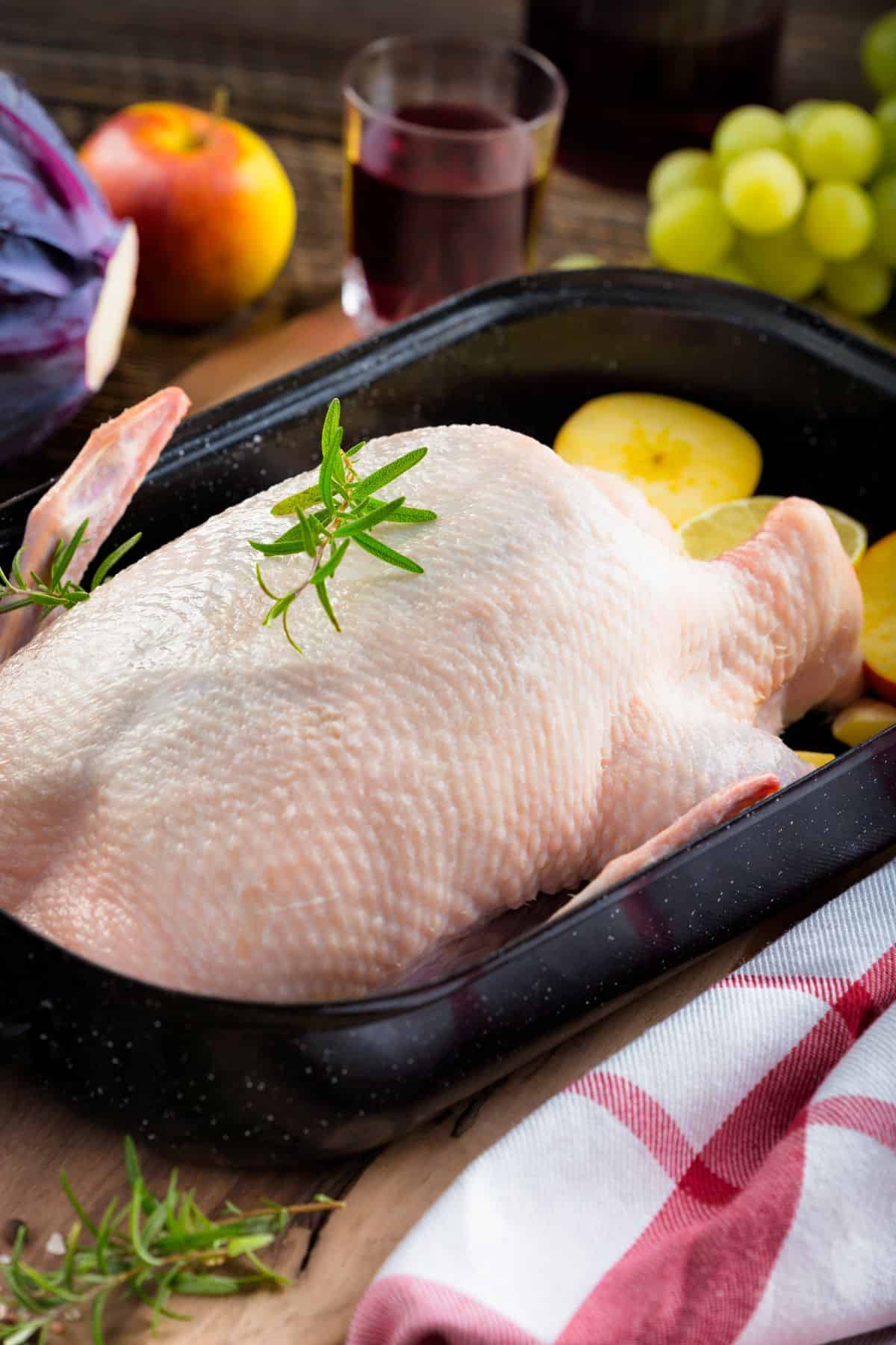 Uncooked meat in the pan before cooking.