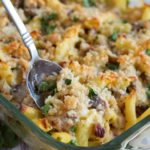 A spoon in a glass casserole dish of the turkey casserole.