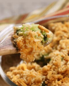A fork of velveeta broccoli casserole with ritz crackers.